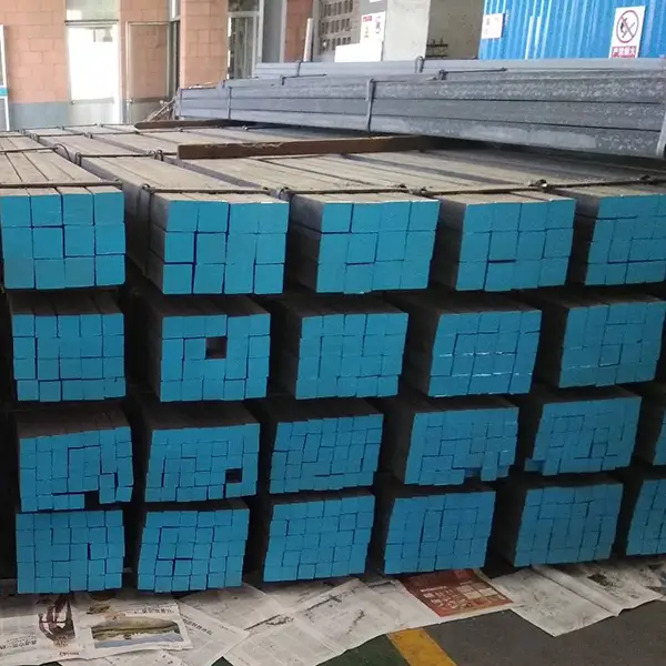 Stacked hot rolled steel square bars ready for industrial shipment