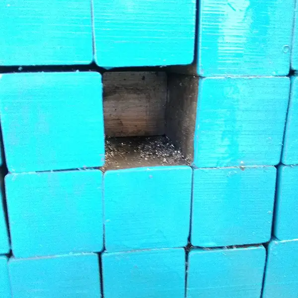 Close-up of hot rolled steel square bar cross-sections showing solid and uniform structure