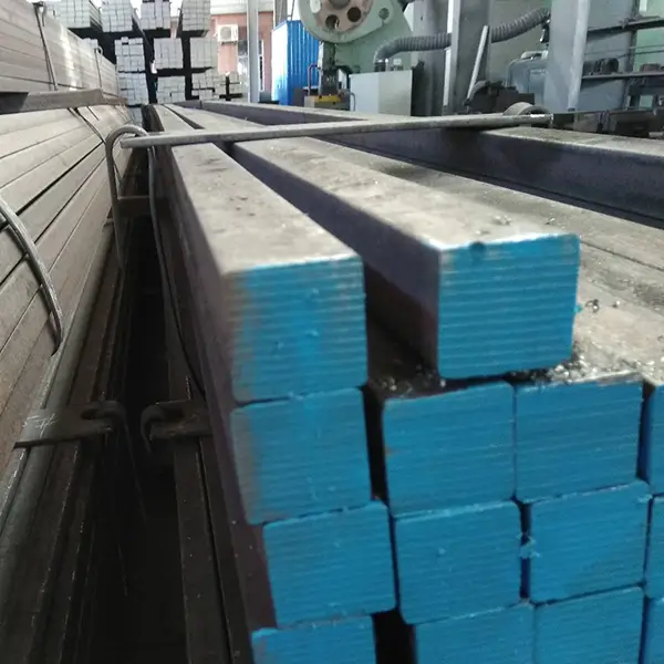 Detailed surface texture of hot rolled square bars with visible rolling marks